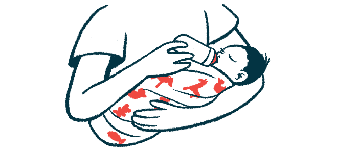 A baby cradled in a person's arms drinks from a bottle.