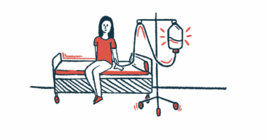 A woman is receiving an intravenous infusion while sitting on a bed.