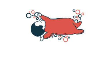 An illustration of an infant boy in red pajamas laying on his back.
