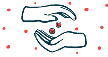A hand drops two pills into another hand.