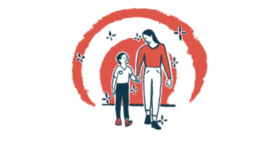 A woman and a boy look at each other and hold hands as they walk.